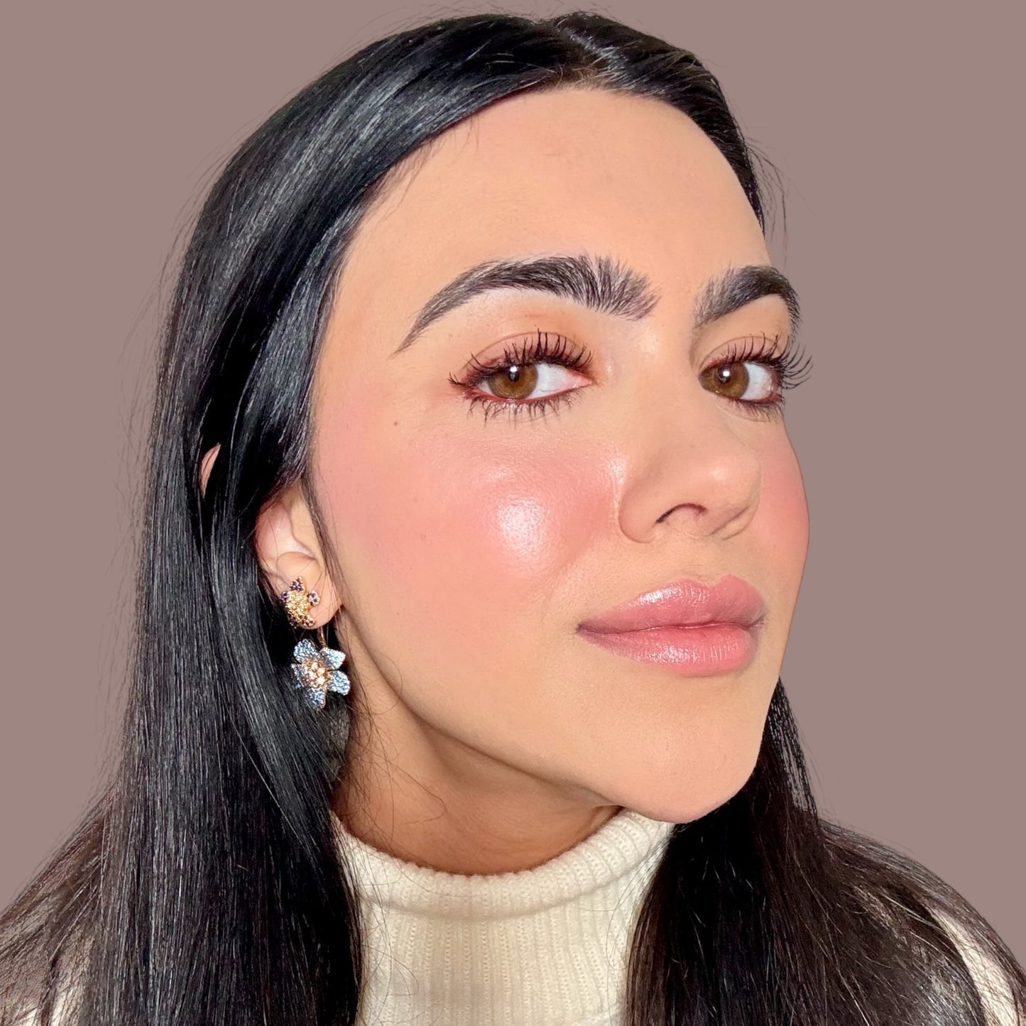 halva beauty founder showing natural brows after using brow oil