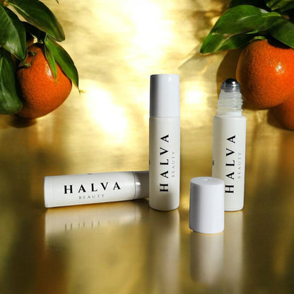 halva beauty brow oil photographed with oranges for glow and nourishment