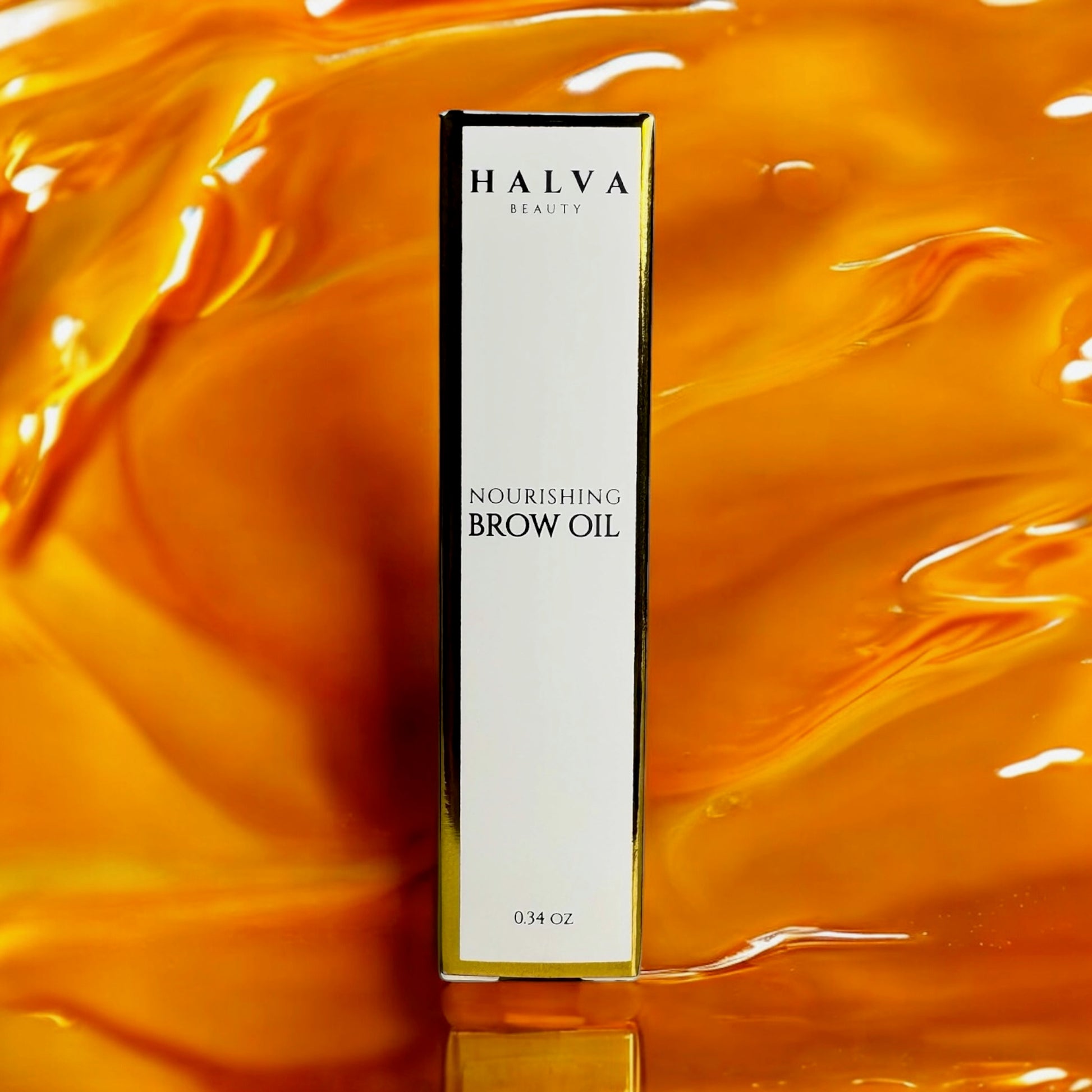 halva beauty nourishing brow oil and packaging on vibrant orange oil background