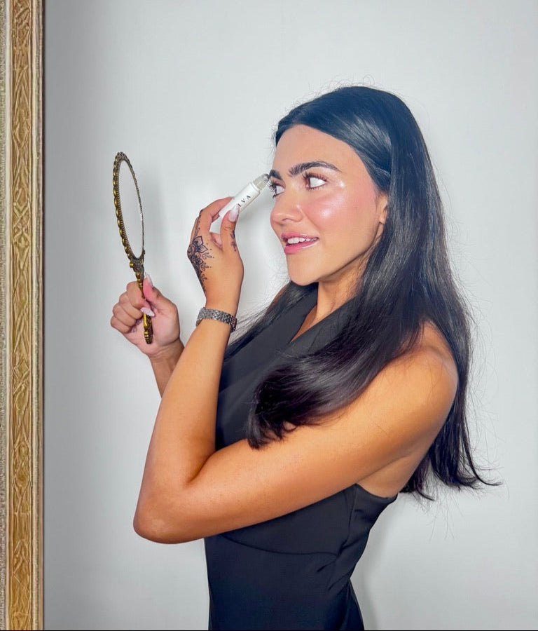 halva beauty founder applying the halva beauty nourishing brow oil