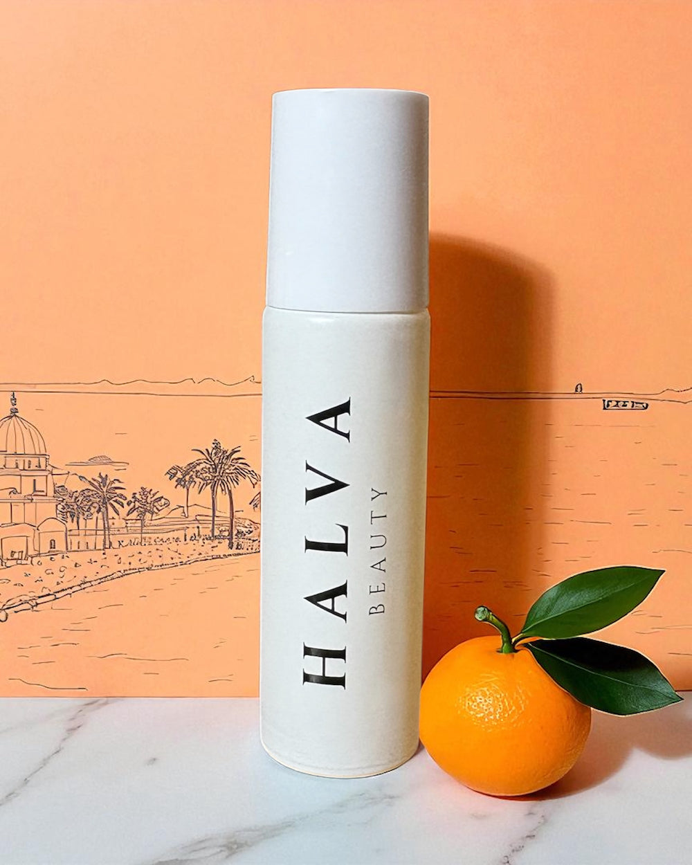halva beauty nourishing brow oil bottle standing upright beside a fresh orange, highlighting sweet orange oil, with an illustrated indian architectural backdrop
