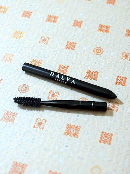 halva beauty spoolie on a patterned background for brow grooming