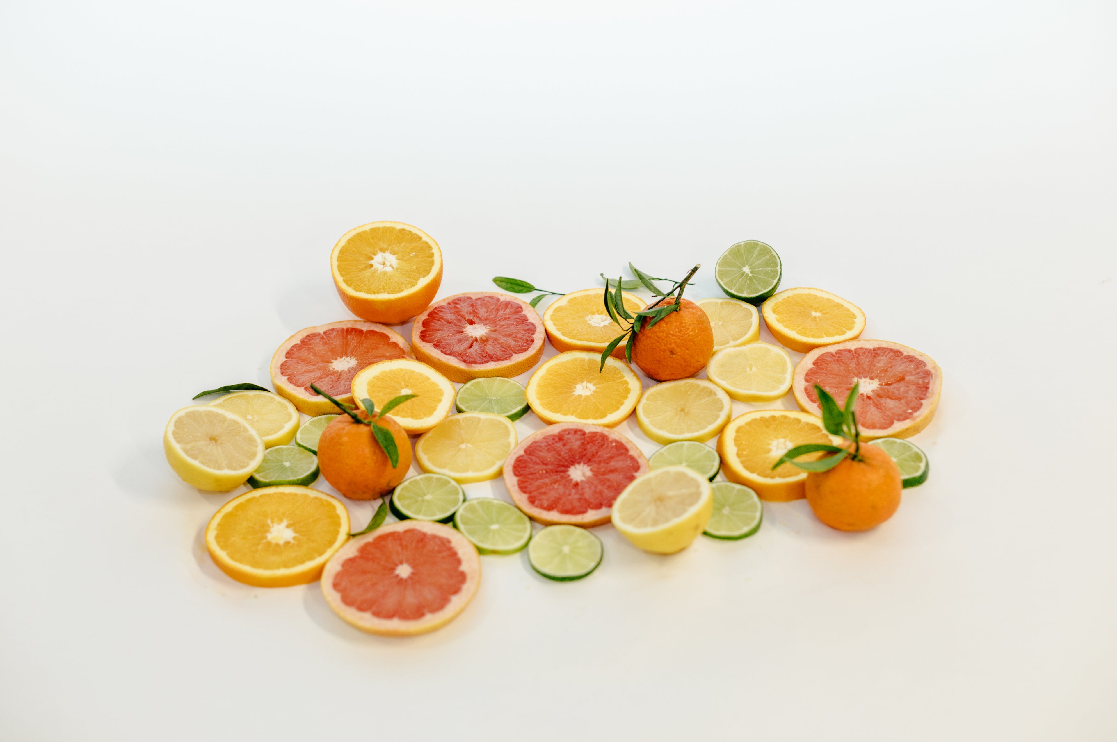 halva beauty vegan brow oil with clean plant based ingredients including citrus inspired background, cruelty free and free from parabens, phthalates, formaldehyde, and gmos