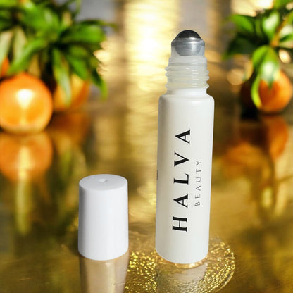 clean beauty brow oil with fresh oranges highlighting vegan, natural ingredients